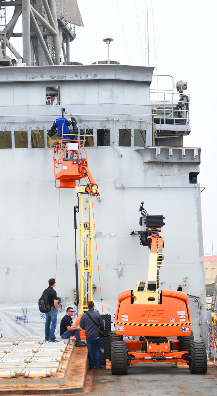 Robots conducting maintenance on a ship