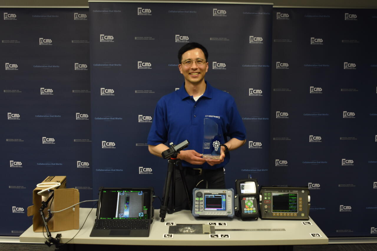 Man at booth displaying new technology